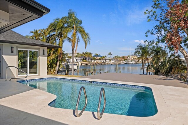 475 Island Way, Clearwater Beach, FL 33767 - outdoor pool with a water view, a boat dock, and a patio