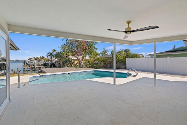 475 Island Way, Clearwater Beach, FL 33767 - view of swimming pool featuring a patio area, a ceiling fan, and a water view