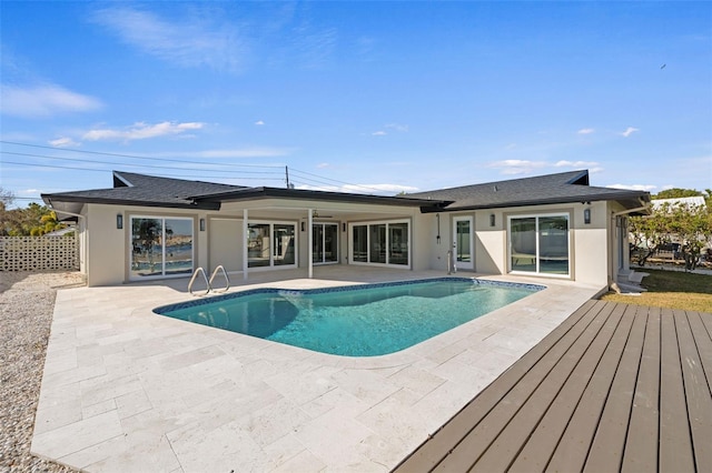 view of swimming pool with a patio area