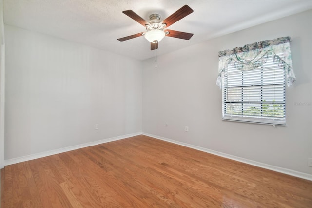 unfurnished room featuring wood-type flooring and ceiling fan