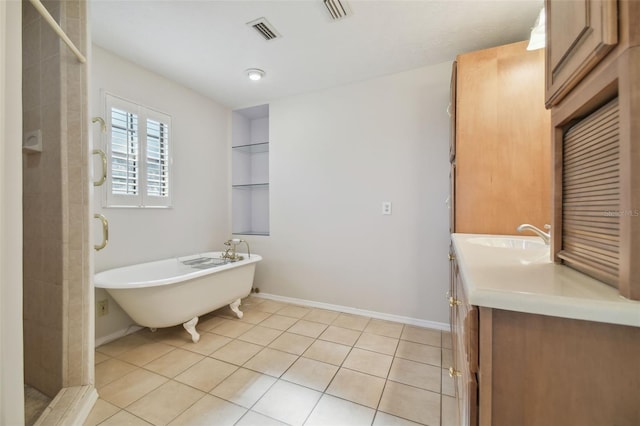 bathroom with tile patterned floors, vanity, and independent shower and bath