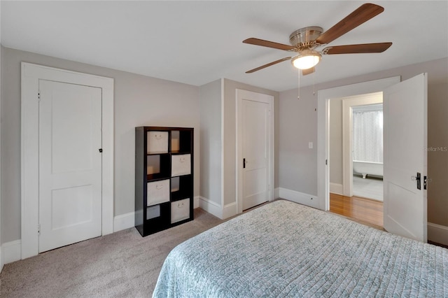 carpeted bedroom with ceiling fan