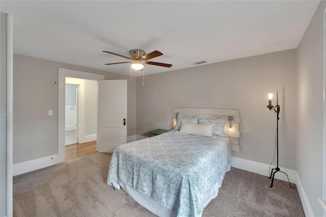 bedroom featuring ceiling fan and light colored carpet