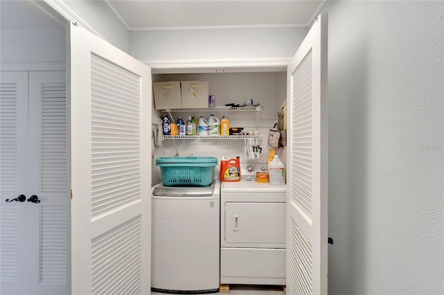 washroom with washing machine and clothes dryer