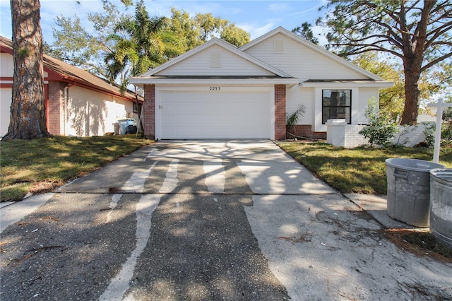 view of front of property with a garage and a front yard