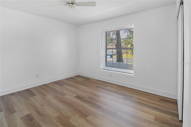 unfurnished room with ceiling fan and wood-type flooring