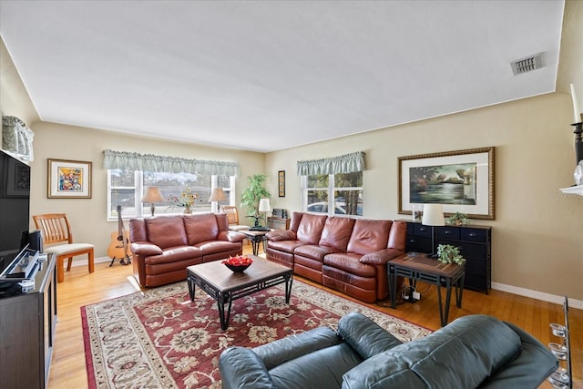 living room with light hardwood / wood-style floors