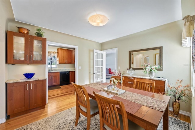 dining area with light hardwood / wood-style floors