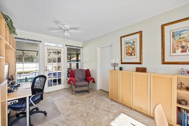 office space with ceiling fan and ornamental molding