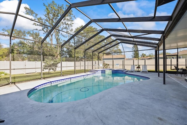 view of pool with a lanai and a patio area