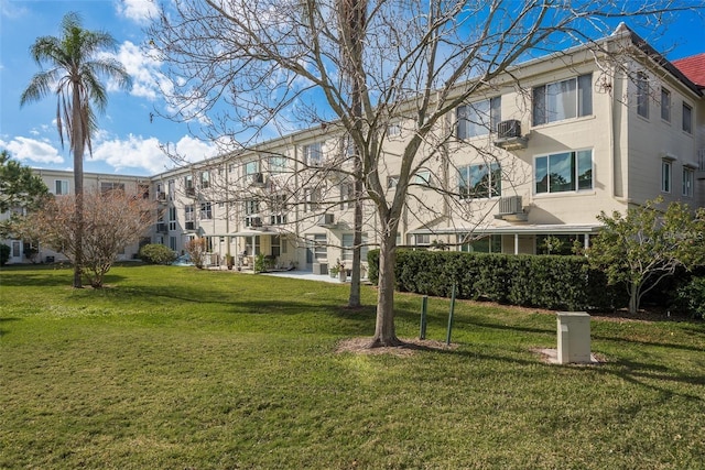 view of home's community with a lawn