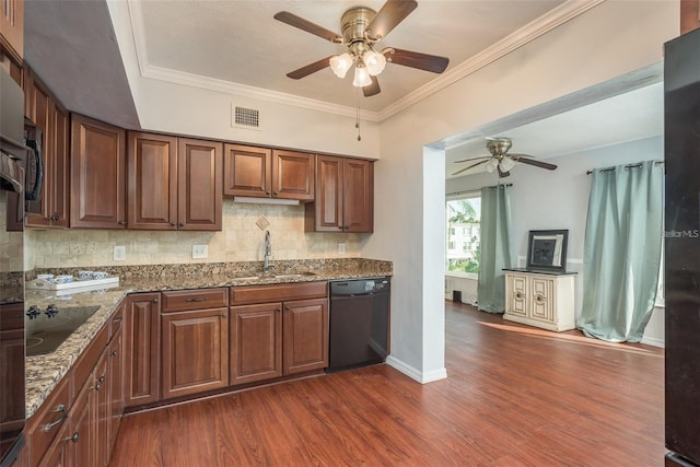 2451 Canadian Way Unit 47, Clearwater, FL 33763 - kitchen featuring black appliances, a ceiling fan, dark wood-style flooring, stone countertops, and backsplash