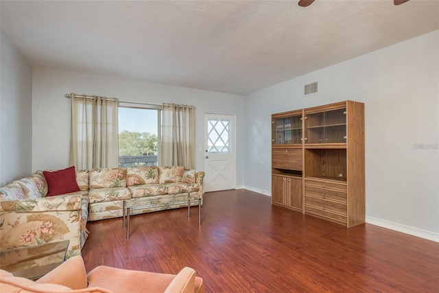 living room with dark hardwood / wood-style floors