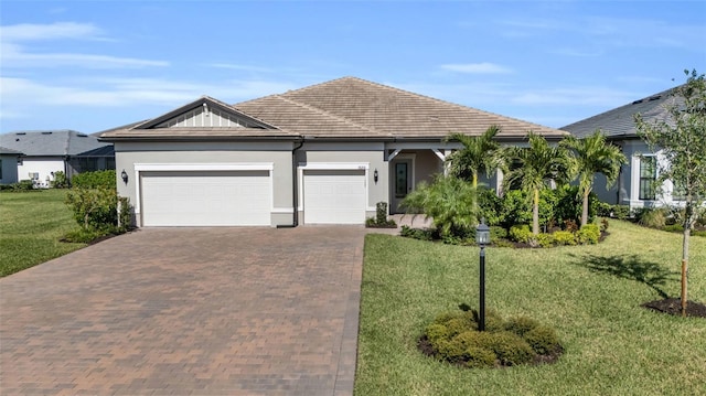 single story home featuring a front yard and a garage