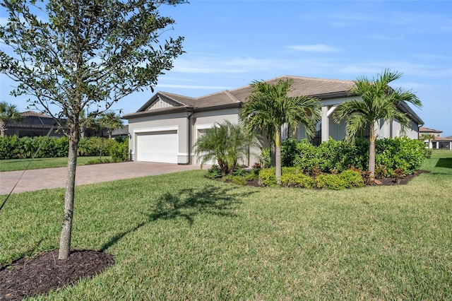 view of front facade with a garage and a front lawn