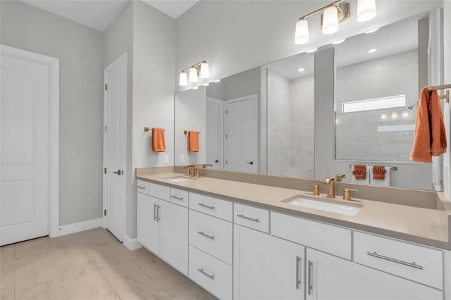 bathroom featuring a tile shower and vanity