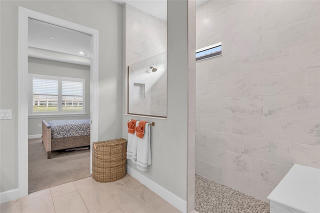 bathroom with tiled shower