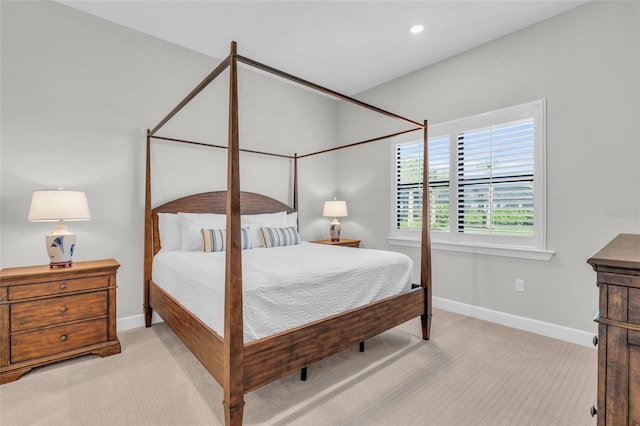 bedroom featuring light carpet