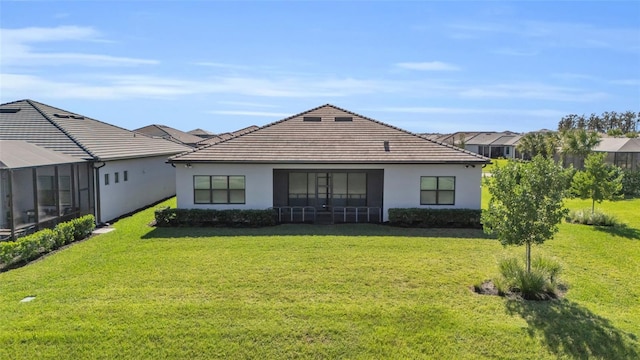 rear view of house with a lawn