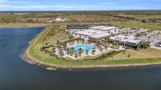 birds eye view of property with a water view