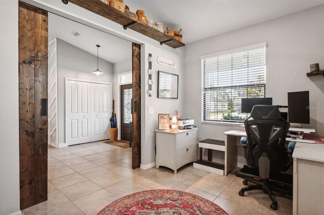 office space with light tile patterned floors and lofted ceiling