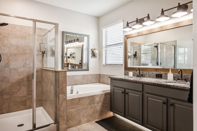 bathroom with tile patterned floors, vanity, and independent shower and bath