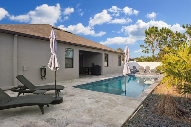 view of swimming pool with a patio