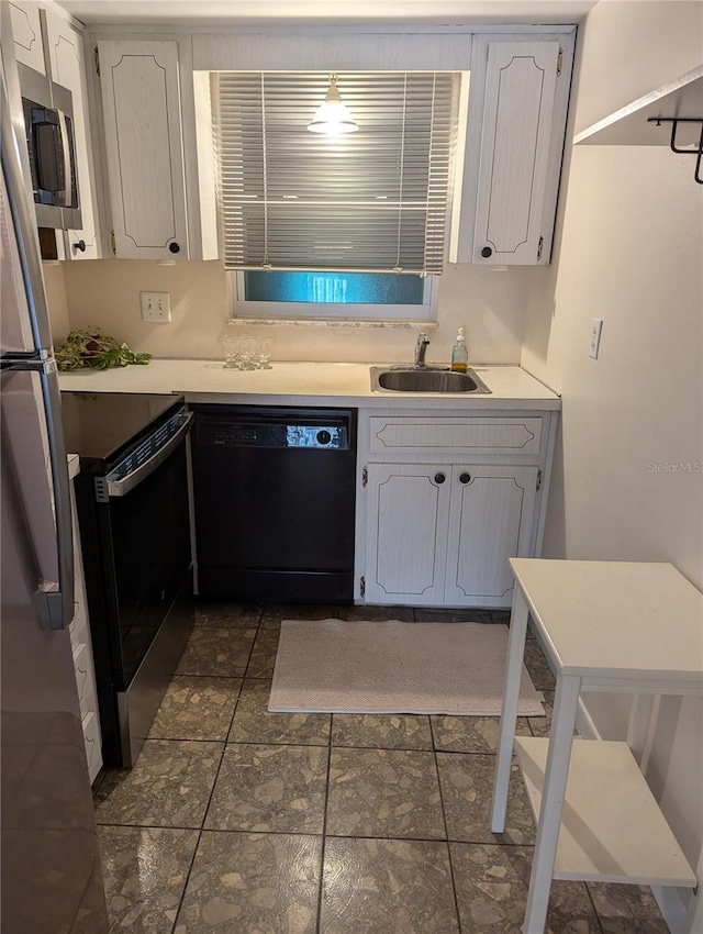 kitchen featuring white cabinets, sink, and stainless steel appliances