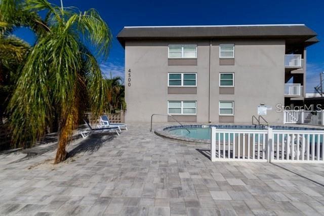 community pool featuring a patio area