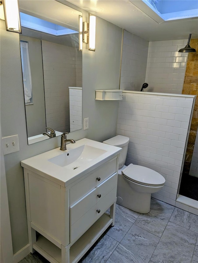 bathroom featuring walk in shower, vanity, and toilet