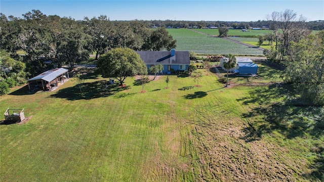 birds eye view of property with a rural view