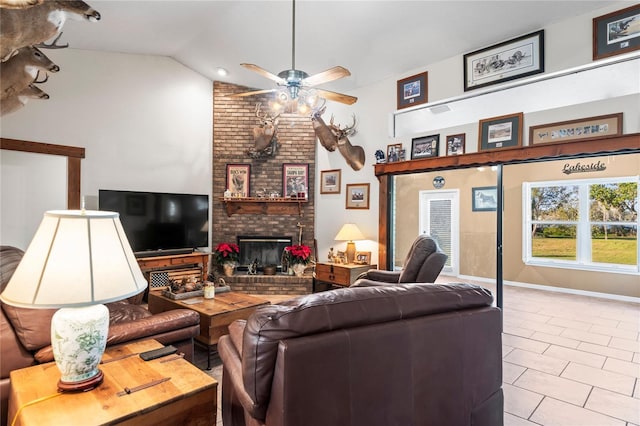 living room featuring ceiling fan, high vaulted ceiling, and a brick fireplace