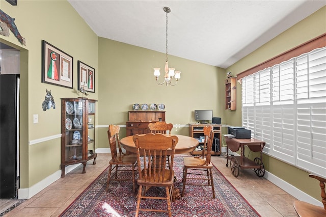 dining space featuring light tile patterned floors, vaulted ceiling, and a notable chandelier