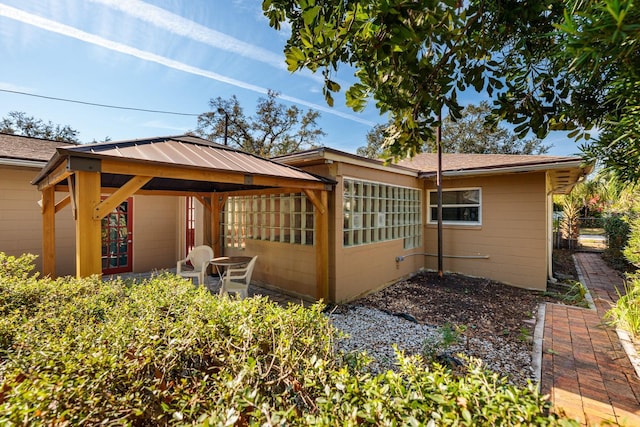 back of house featuring a gazebo and a patio