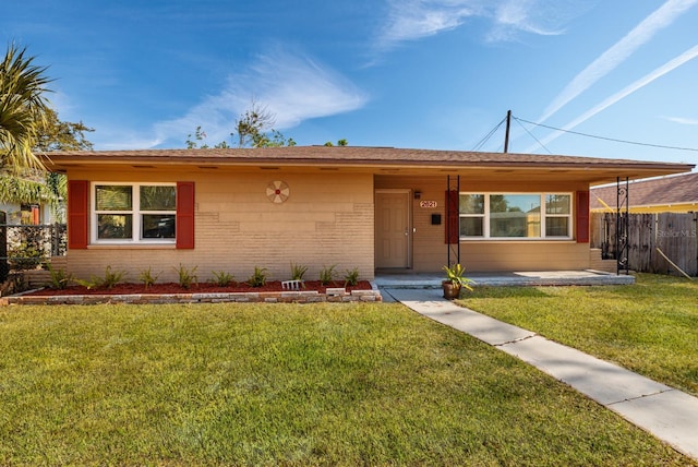 single story home with a front yard