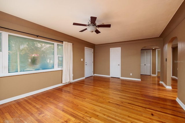 spare room featuring light hardwood / wood-style flooring and ceiling fan