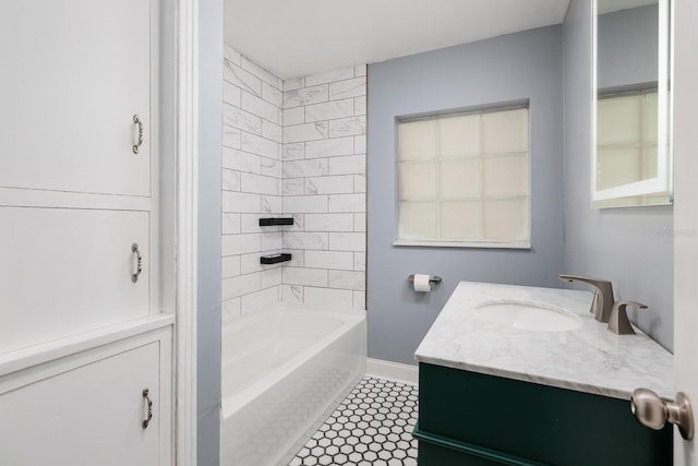 bathroom featuring tile patterned flooring, vanity, and tiled shower / bath combo