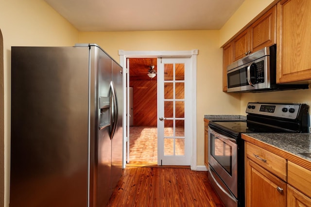 kitchen featuring french doors, stainless steel appliances, and dark wood-type flooring