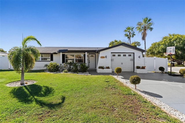 ranch-style home with a garage and a front lawn