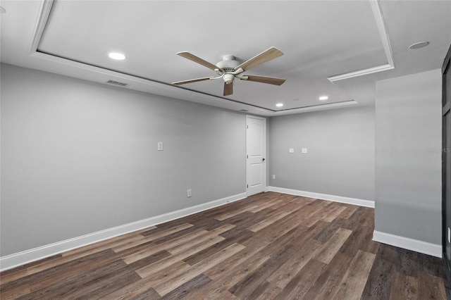 unfurnished room featuring ceiling fan and dark hardwood / wood-style flooring