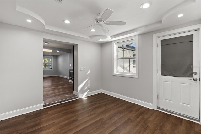 foyer with dark hardwood / wood-style floors and ceiling fan