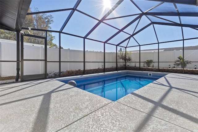 view of pool featuring a lanai and a patio area