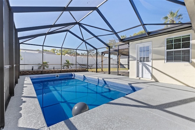 view of pool with a lanai and a patio