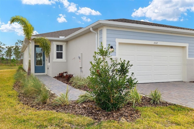 single story home featuring a garage