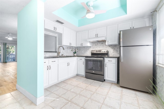 kitchen with white cabinetry, sink, ceiling fan, backsplash, and appliances with stainless steel finishes