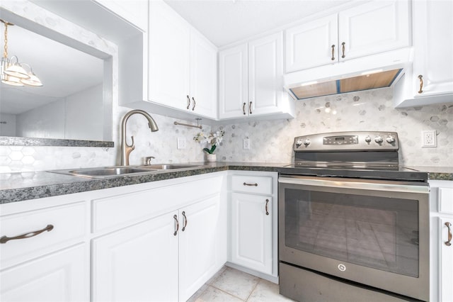 kitchen with tasteful backsplash, sink, white cabinets, stainless steel electric range oven, and light tile patterned flooring