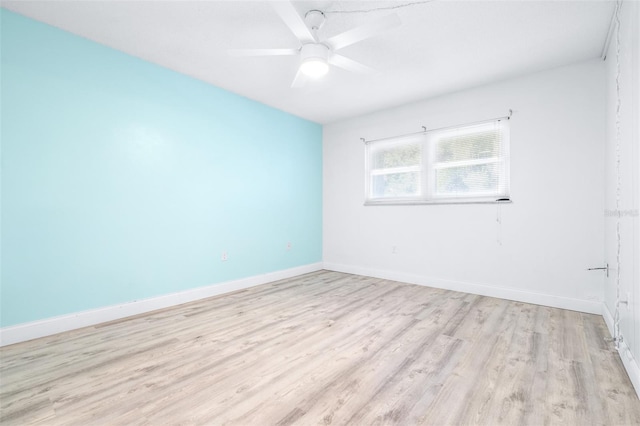 spare room with ceiling fan and light hardwood / wood-style floors