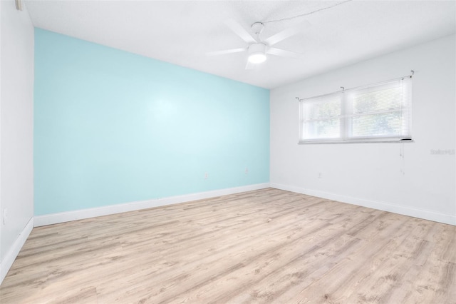 spare room with ceiling fan and light hardwood / wood-style floors