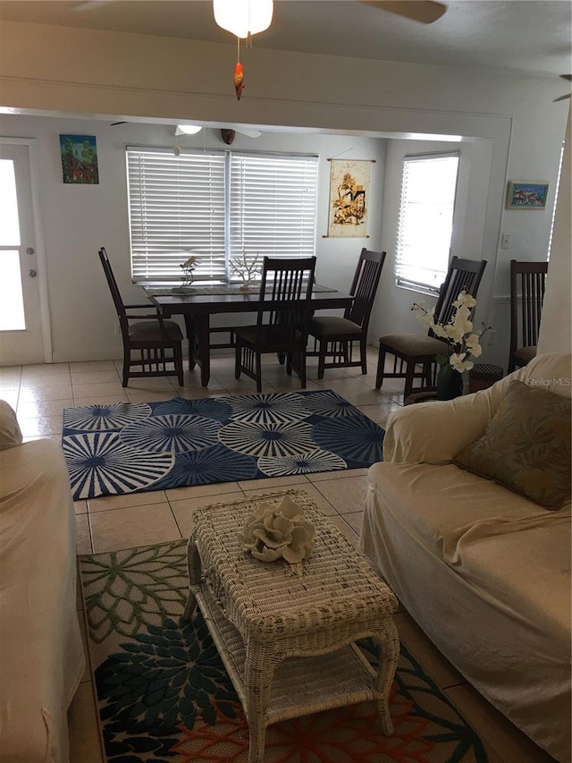 78 146th Ave E, Madeira Beach, FL 33708 - living area featuring light tile patterned flooring and ceiling fan