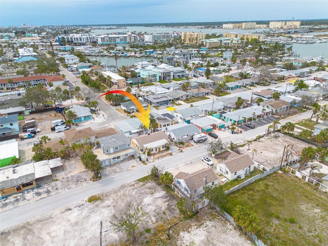 78 146th Ave E, Madeira Beach, FL 33708 - aerial view of property and surrounding area featuring a large body of water and nearby suburban area